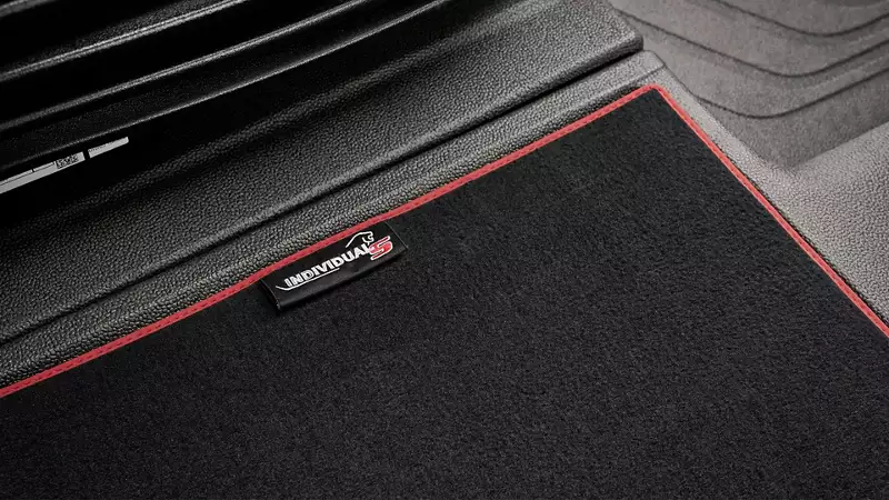 Doormat with red stitching, piping and label